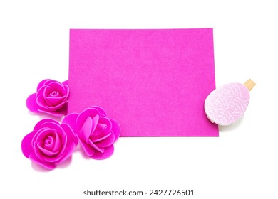 Pink blank greeting card with rose flowers with colored eggs. Copy space. Free space for text. Happy easter!	 - Powered by Shutterstock