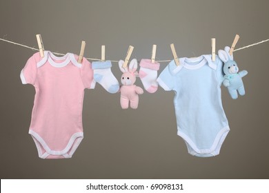 Pink And Blue Baby Goods Hanging On The Clothesline