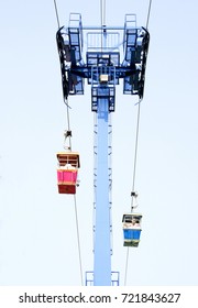 The Pink And Blue Cable Car Is Running On The Cable Pass Column In DREAMWORLD Theme Park 