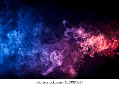 Pink And Blue Cloud Of Smoke Of  Black Isolated Background. Background From The Smoke Of Vape