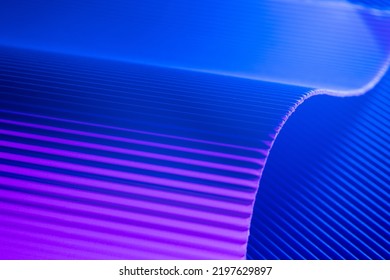 Pink and blue illuminated corrugated shapes. Geometric abstract background. - Shutterstock ID 2197629897