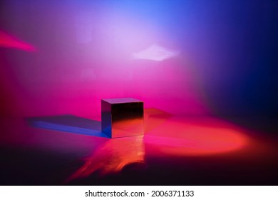 Pink And Blue Neon Lighted Background. Mirror Light Cube With Copy Space