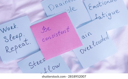 Pink and blue sticky notes featuring handwritten messages about consistency, emotional fatigue, and mental health motivation