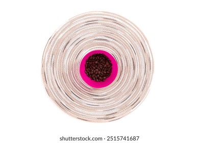 Pink bowl of roasted coffee beans on a circular patterned mat - Powered by Shutterstock