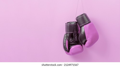 Pink Boxing Gloves On A Pink Background. Symbol Of The Struggle For Women Rights And Against Breast Cancer. Template Copy Space For Text. Mock-up.