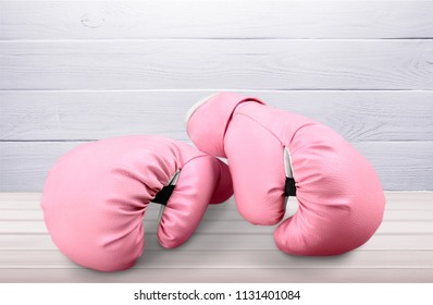 Pink Boxing Gloves On Desk