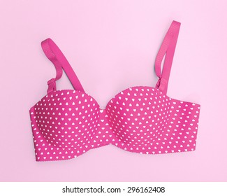 pink bra with many heart shapes on pink background