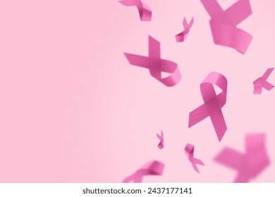 Pink Breast Cancer Awareness Ribbon. Flying pink ribbons on pink background. Breast cancer awareness and October Pink day, world cancer day. Top view. Mock up.  - Powered by Shutterstock