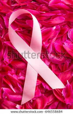 Pink Breast Cancer Ribbon on blossom background. Top view.