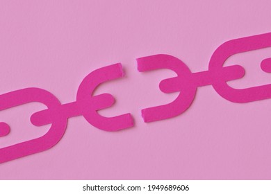 Pink broken chain on pink background - Concept of woman and freedom