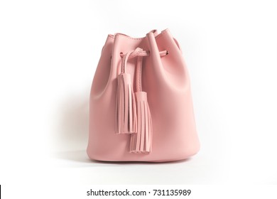 A Pink Bucket Bag With Fringe/tussle.