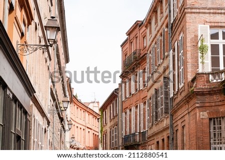 pink building alley in the heart of the old city of Toulouse Haute-Garonne in France