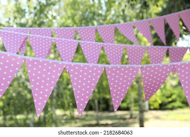 Pink Bunting Flags In Park. Party Decor