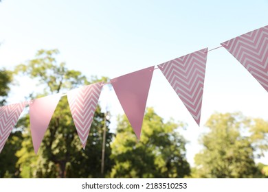 Pink Bunting Flags In Park. Party Decor