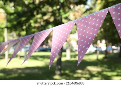 Pink Bunting Flags In Park. Party Decor