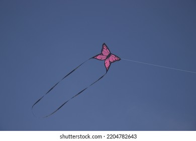 A Pink Butterfly Kite Is Flying.