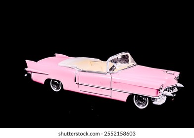 Pink Caddilac Car Toy Model Isolated on a Black Background - Powered by Shutterstock