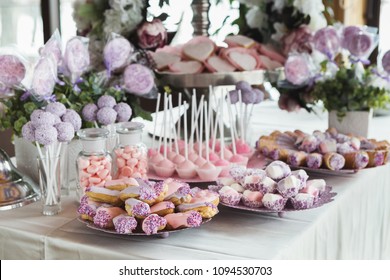 Pink Candy Bar For Holiday Celebration. Sweet Buffet For Birthday Party Or Wedding. Desserts Assortment Against Wooden Background, Catering Concept