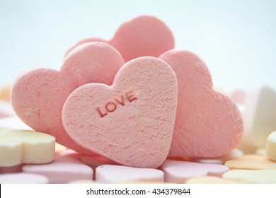 Pink Candy Hearts With The Word Love