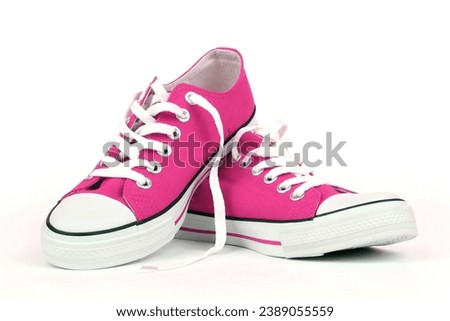 Pink canvas shoes isolated on white background