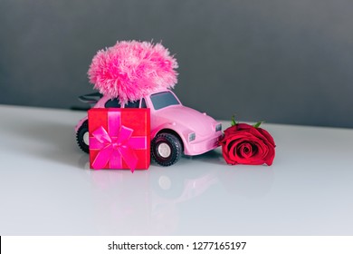 Pink Car, Gift Box With Red Bow And Rose Red. Valentine's Day Concept.