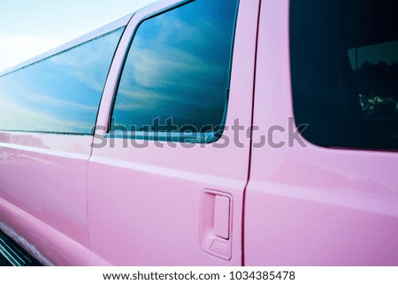 Pink car on the street