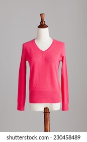 Pink Cashmere Sweater With Wood Model On Grey Isolated