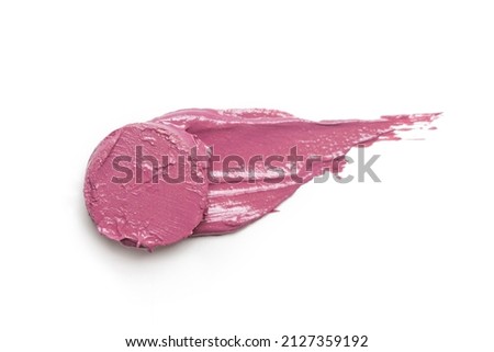Pink ceamy makeup sample islated on white background. Decorative cosmetic smear.