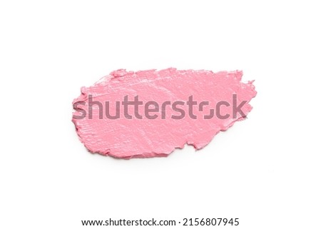 Pink ceamy makeup sample islated on white background. Decorative cosmetic smear.	