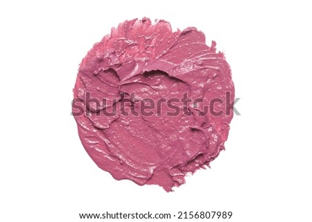 Pink ceamy makeup sample islated on white background. Decorative cosmetic smear.	