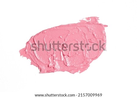 Pink ceamy makeup sample islated on white background. Decorative cosmetic smear.	