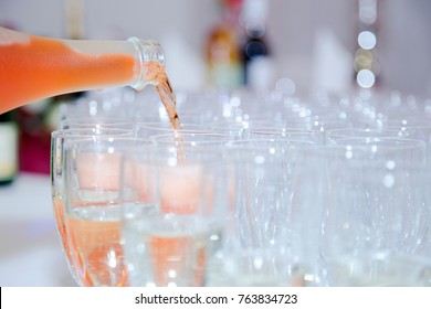 Pink Champagne Poured Into Glasses