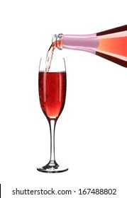 Pink Champagne Pouring In A Glass. Close Up