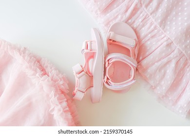 Pink Children's Sandals And Dresses, Top View.