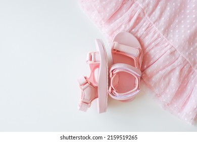 Pink Children's Sandals And Dresses, Top View.