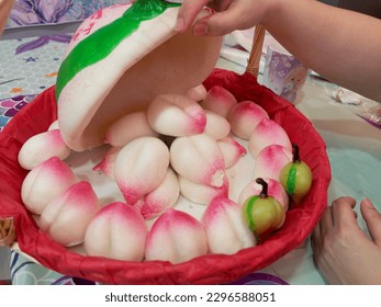 Pink Chinese peach birthday bun food named Longevity peach Shou Tao (寿桃)       
