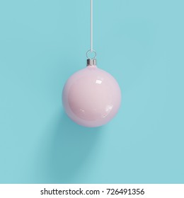 Pink Christmas ball Ornaments on blue background. minimal concept idea.
