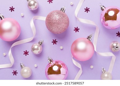 Pink christmas balls with decor on color background, top view - Powered by Shutterstock