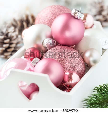 pink christmas baubles in a white shabby chic tray with christmas decorations at the background - Pink Christmas Decorations pink christmas baubles in a white shabby chic tray with christmas decorations at the background - Pink Christmas Decorations