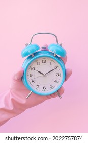 Pink Cleaning Gloves And Clock