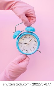 Pink Cleaning Gloves And Clock