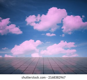Pink Clouds, Blue Sky, Gray Floor. Neon Dramatic Background.