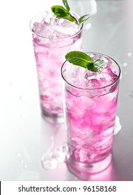 Pink Cocktail With Mint Garnish.