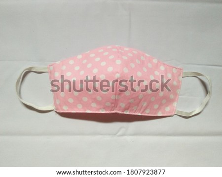Pink color face mask made outof cotton