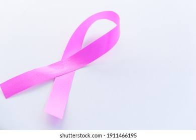 pink color ribbon on white background close up  - Shutterstock ID 1911466195