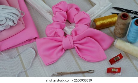 Pink Color Scrunchies For Ponytail Hairstyle Made Out Of Silk Satin Fabric With Bow Design. This Elastic Rubber Band Scrunchies Handmade DIY Project Detail Is Great For Summer Accessories.