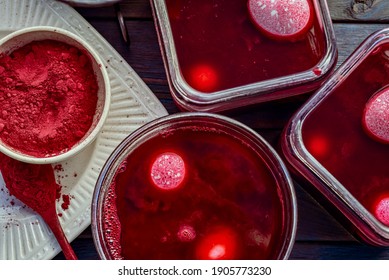 Pink Colored Boiled Eggs In Containers Of Natural Red Dye Bath Made With Beet Root Powder