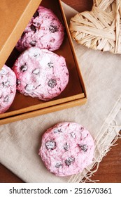 Pink Cookies In Paper Box On Table Close-up