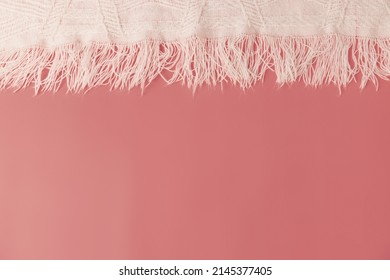 A Pink Coral Background With A Fringe Blanket Top Header And Copy Space.