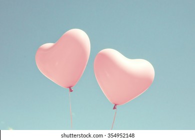 Pink Coral Heart Balloons Over A Pastel Blue Sky